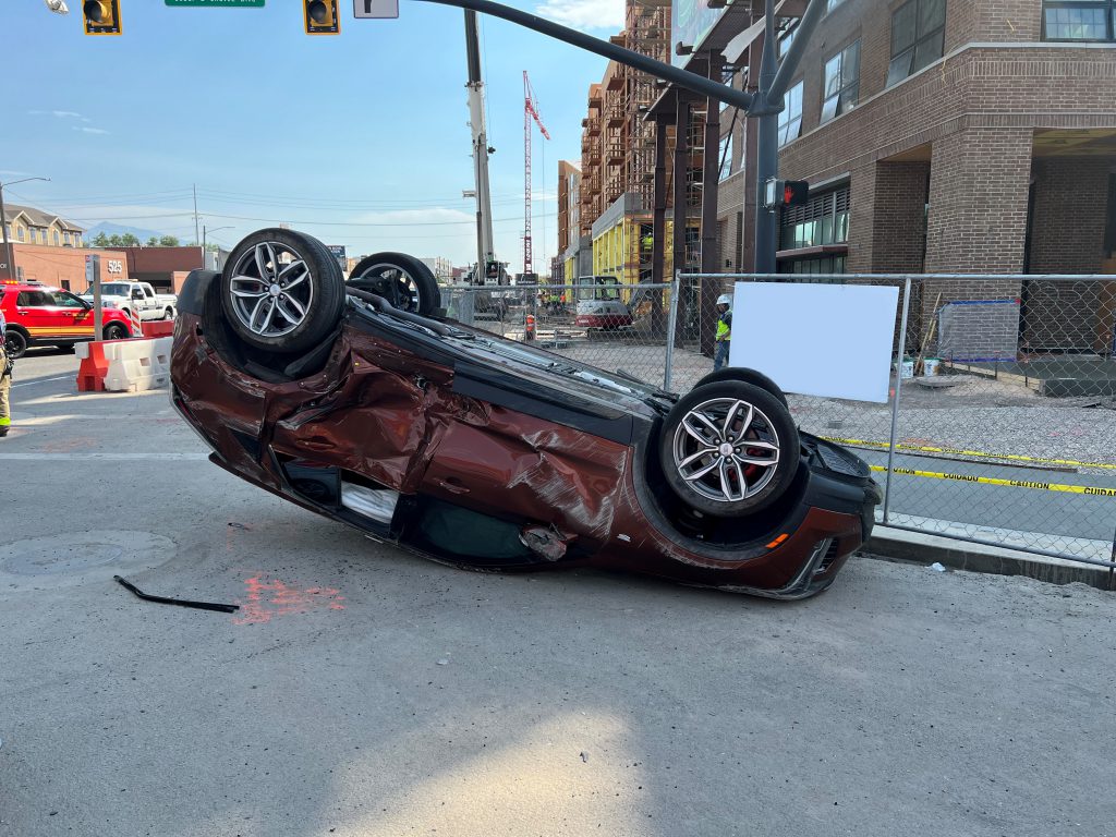 A car that has crashed and ended up on it's roof