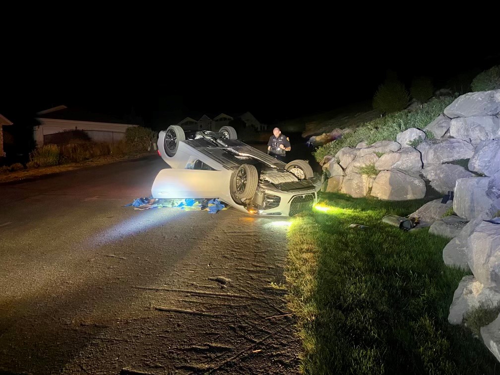 A car that has crashed and ended up on it's roof