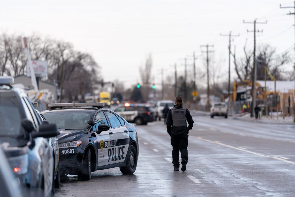 A photo of a crash scene and a crime lab technician.