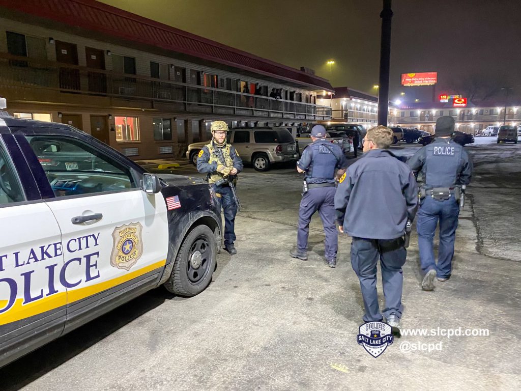 A photo of three patrol officers and one SWAT operator.