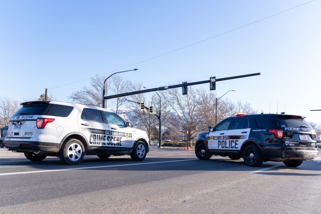 Photo of crime lab and a cop car.