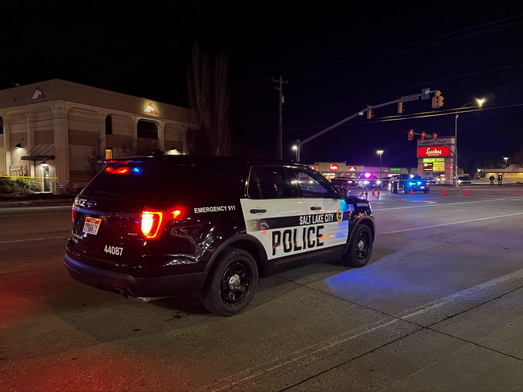 A SLCPD police SUV blocking the intersection of a deadly crash on Redwood Road.