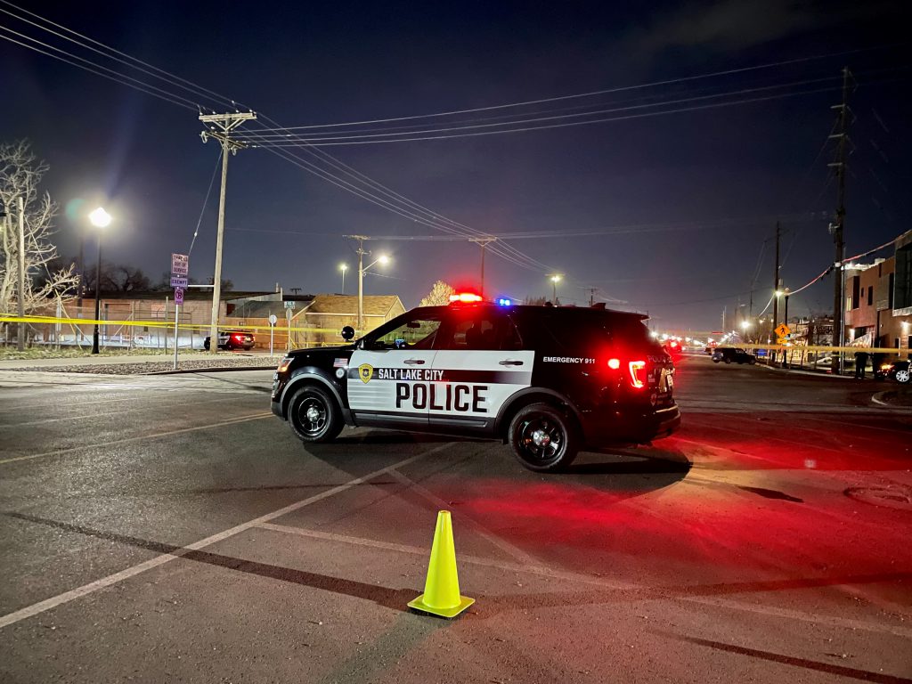 A SLCPD SUV with its lights on.