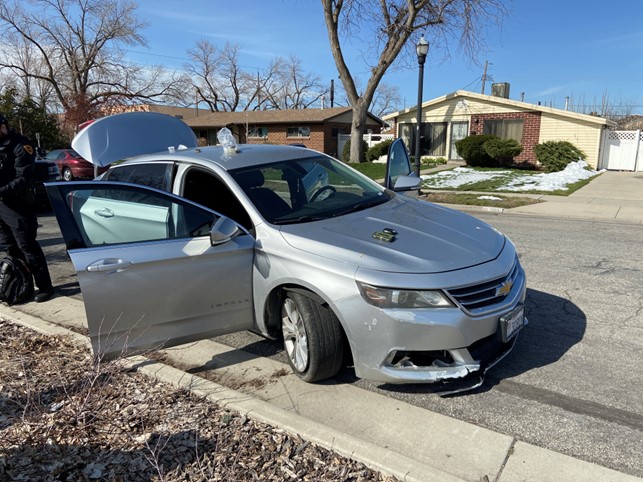 A picture of a car with the door and trunk open