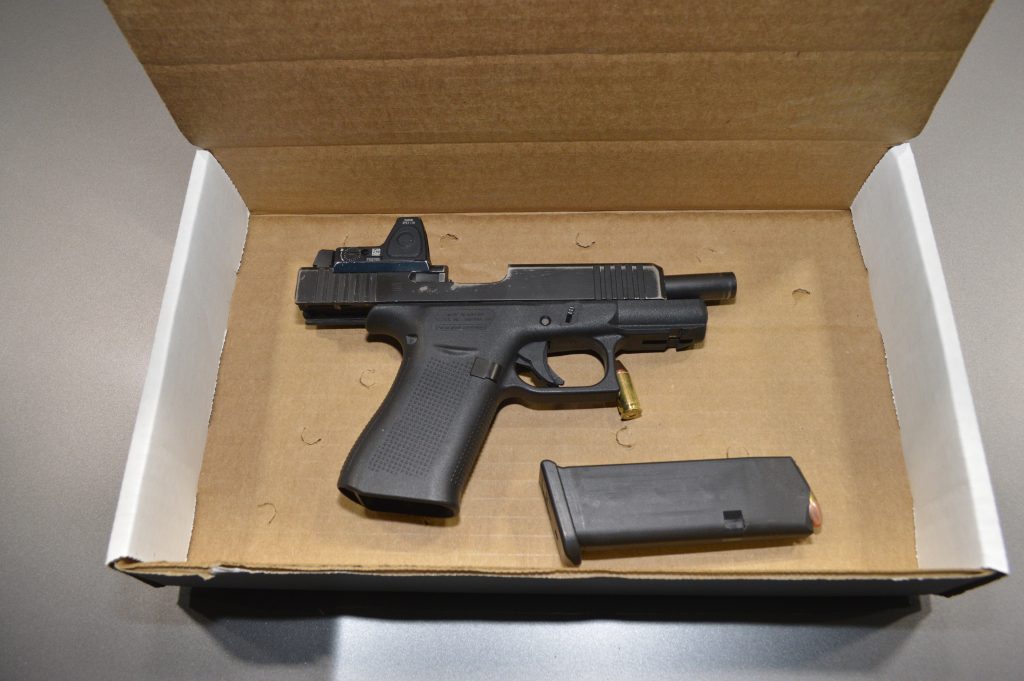 A handgun and magazine in a box