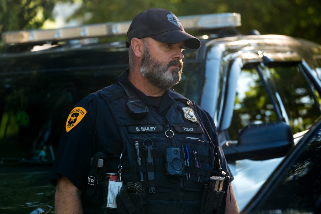 1- A Salt Lake City police officer talks to another officer during a stolen motorcycle investigation (SLCPD photo | August 14, 2023).