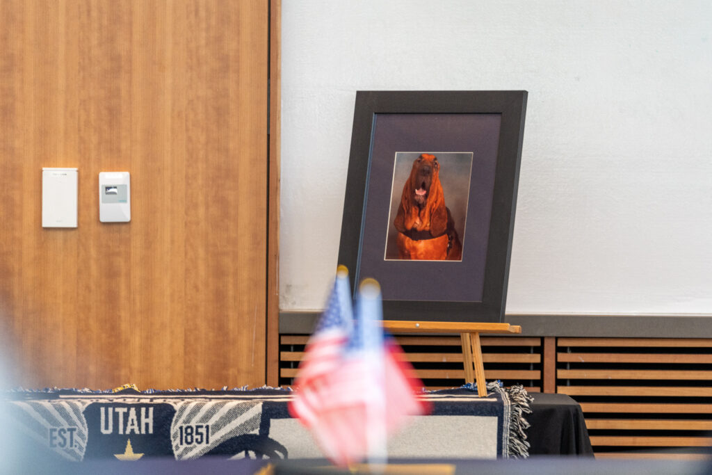 A photo of memorial decorations including a picture of K9 Bruce (SLCPD photo - April 17, 2024).