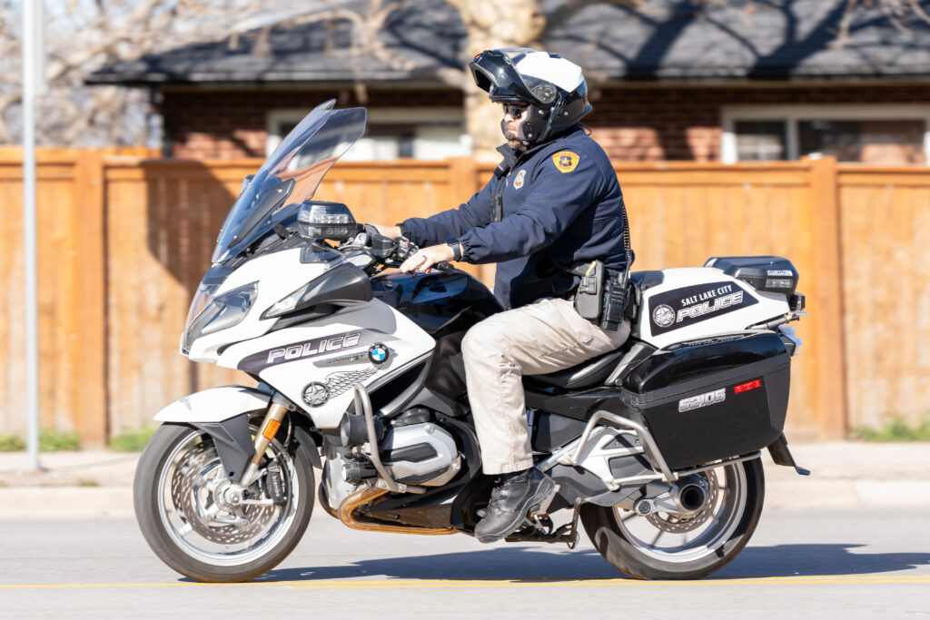 Photo: A Salt Lake City motorcycle officer riding on Foothill Drive (SLCPD photo; April 11, 2024).