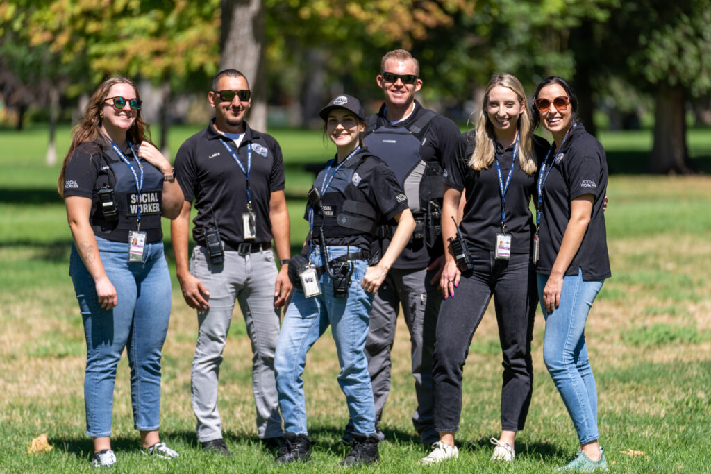 Photo: A team of Salt Lake City Police Department social workers stand for a photo in Liberty Park (SLCPD photo – August 22, 2024).