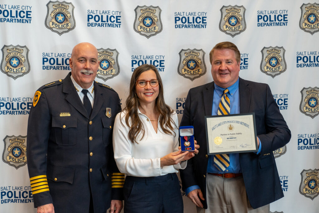 Mayor Erin Mendenhall and Chief Mike Brown award Ned Maxfield the Partner in Public Safety Award