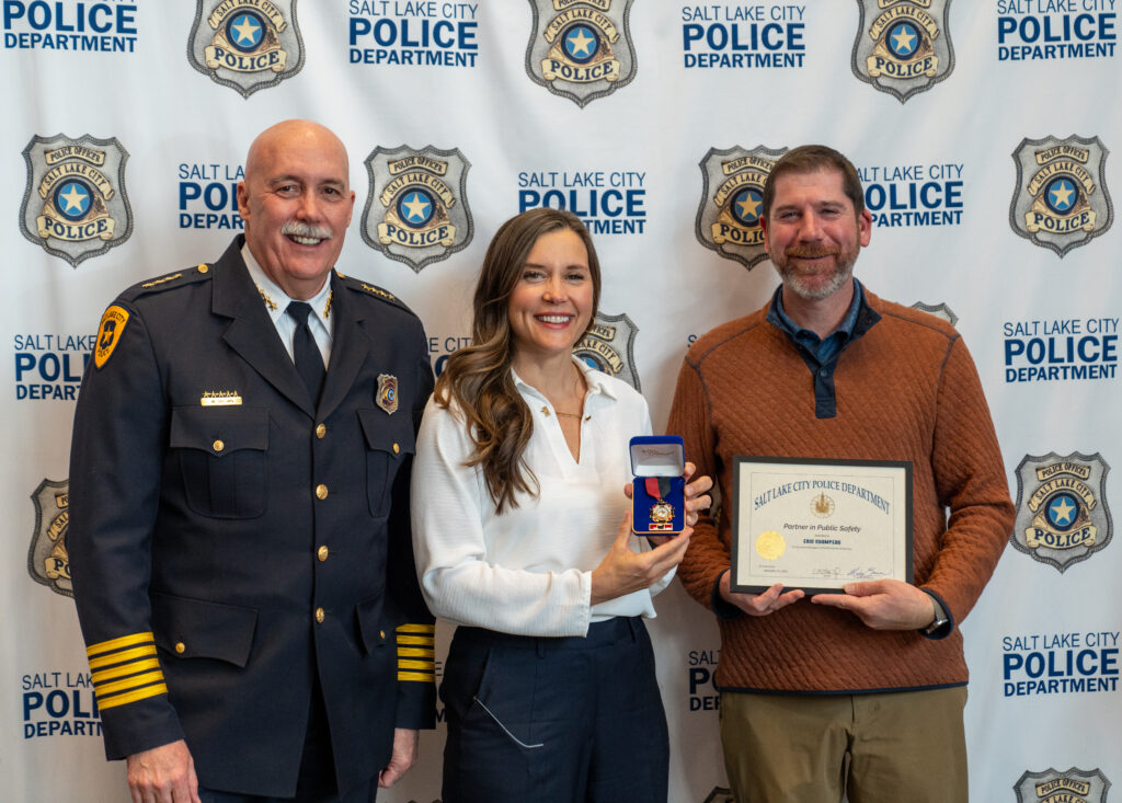 Mayor Erin Mendenhall and Chief Mike brown award Eric Champeau the Partner in Public Safety Aaward