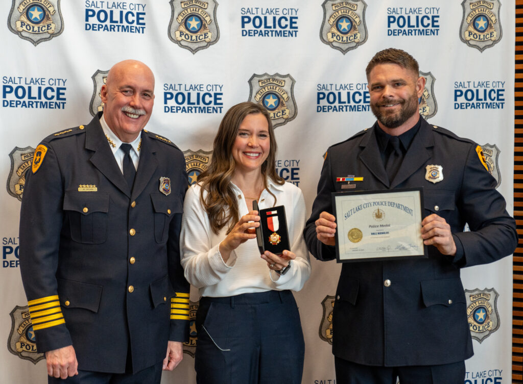 Mayor Erin Mendenhall and Chief Mike Brown award Detective Dale Nicholas the Police Medal